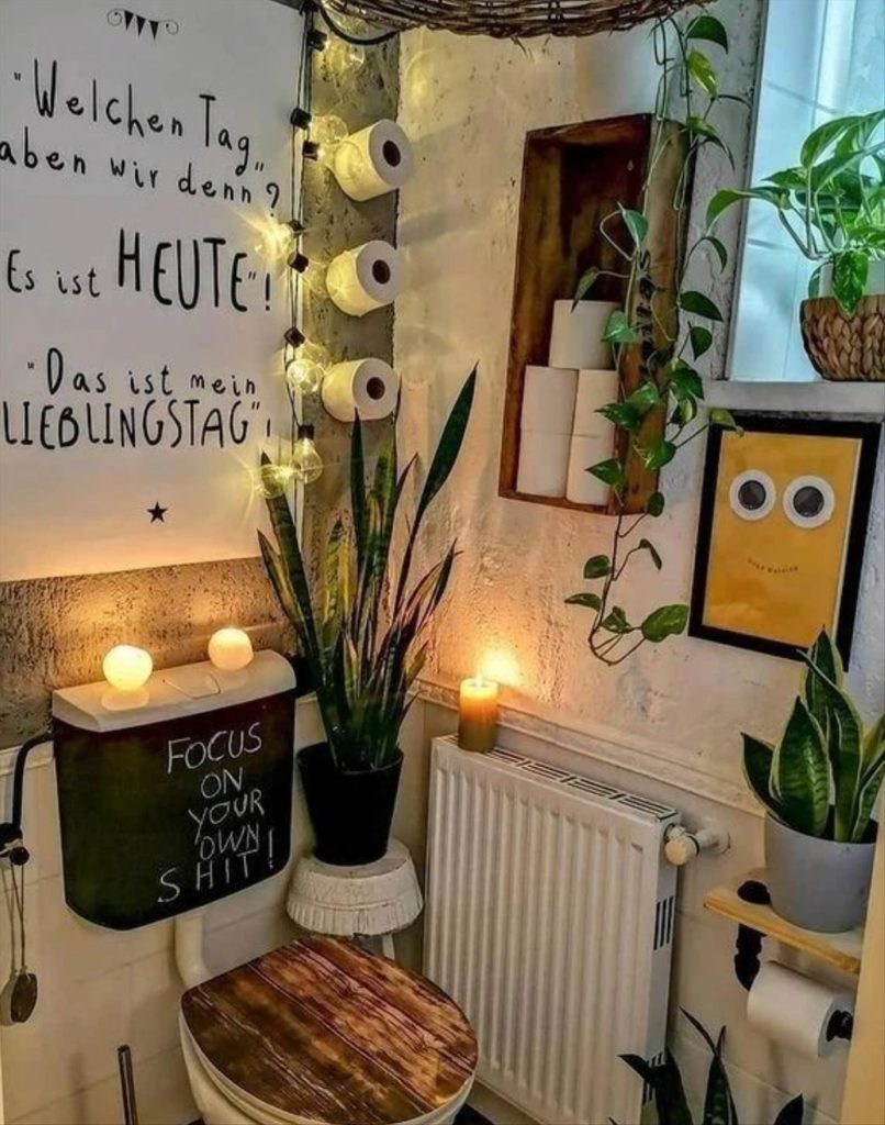 Let's talk about how to decorate the perfect boho bathroom. I noticed some common themes in the bathroom below. They feature houseplants, bamboo wood trim, and teal cabinets or tiles. Keep this in mind when looking for trends in boho bathroom design. Use natural materials and try to keep your decor as unpretentious as possible.