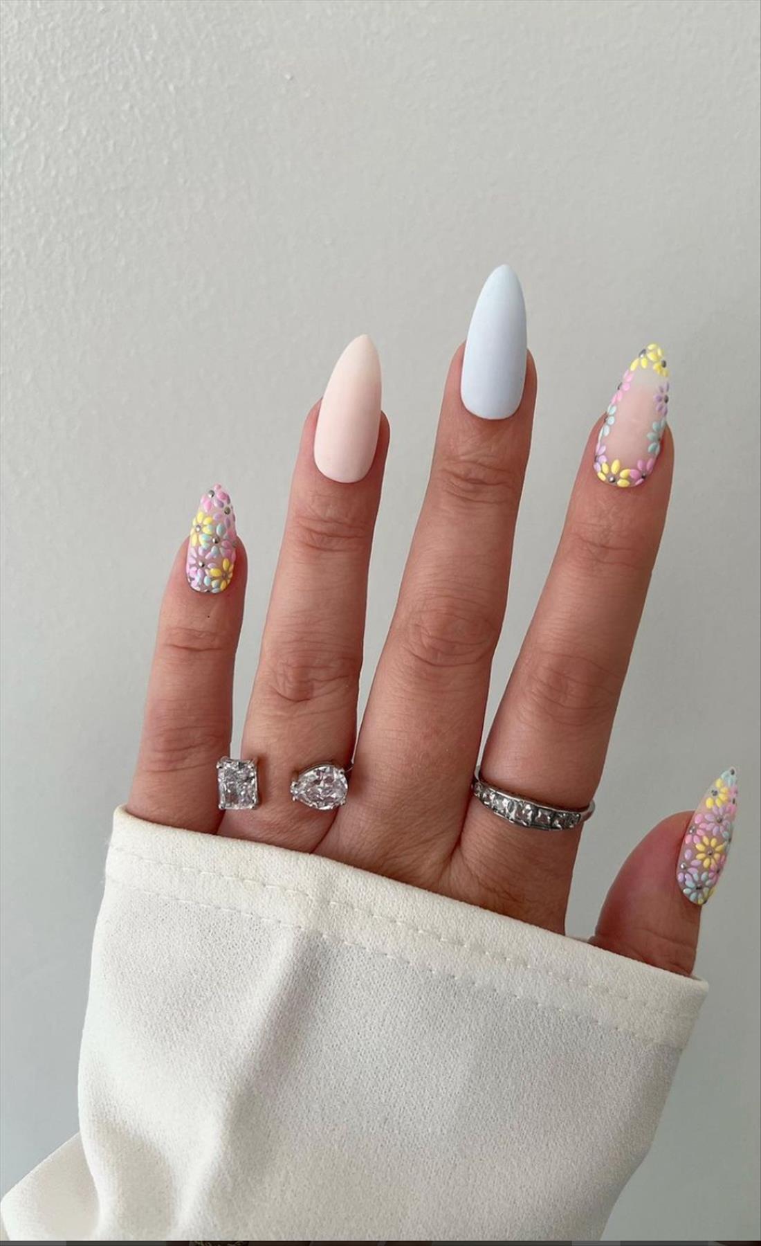 Trendy nail art with short almond shaped nails 2022