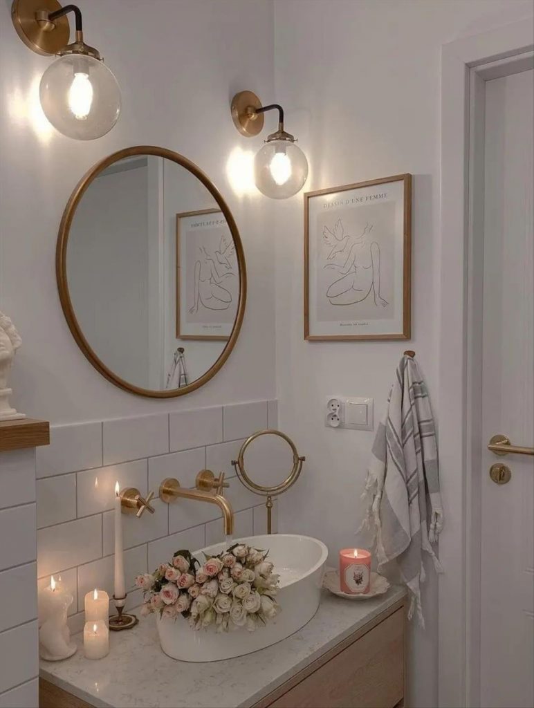 Let's talk about how to decorate the perfect boho bathroom. I noticed some common themes in the bathroom below. They feature houseplants, bamboo wood trim, and teal cabinets or tiles. Keep this in mind when looking for trends in boho bathroom design. Use natural materials and try to keep your decor as unpretentious as possible.