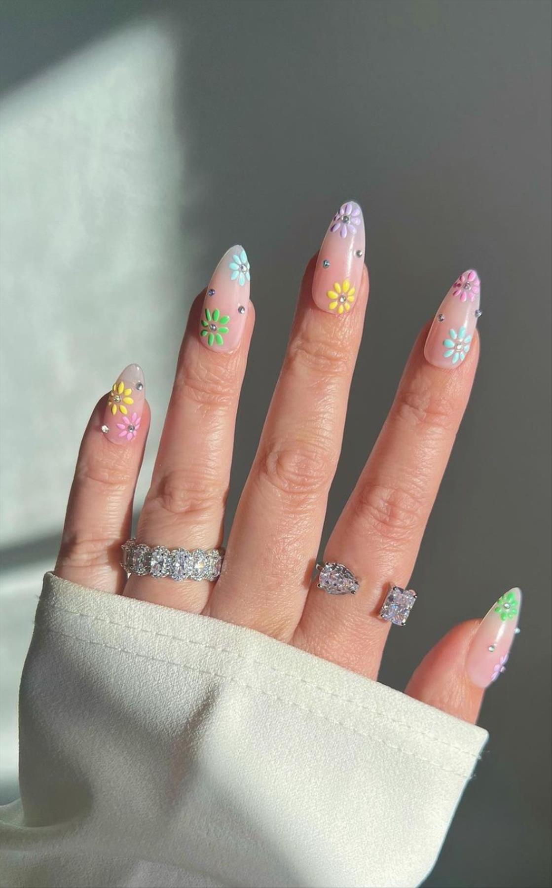 Trendy nail art with short almond shaped nails 2022