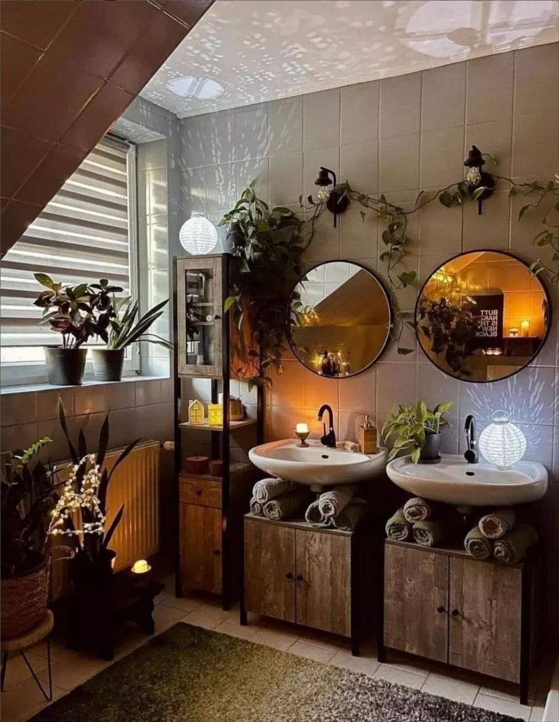 Let's talk about how to decorate the perfect boho bathroom. I noticed some common themes in the bathroom below. They feature houseplants, bamboo wood trim, and teal cabinets or tiles. Keep this in mind when looking for trends in boho bathroom design. Use natural materials and try to keep your decor as unpretentious as possible.