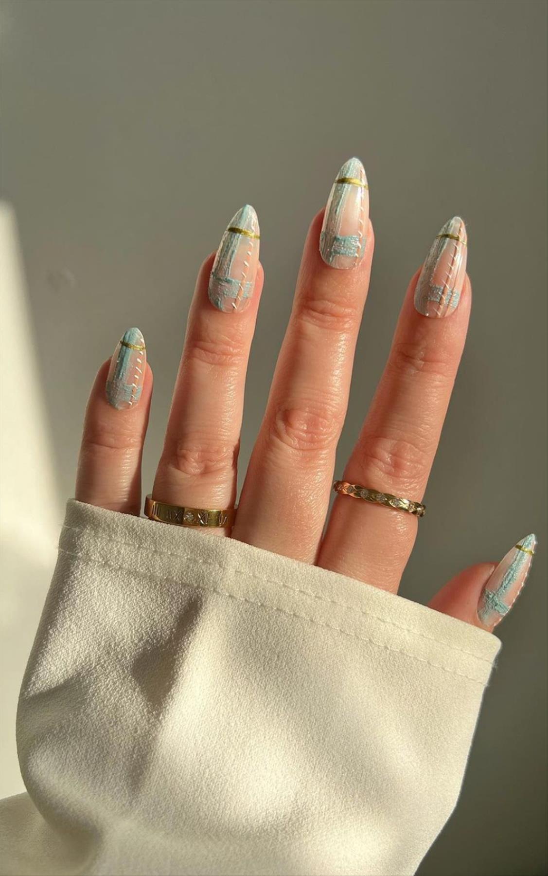 Trendy nail art with short almond shaped nails 2022