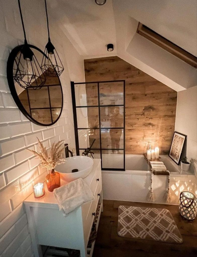 Let's talk about how to decorate the perfect boho bathroom. I noticed some common themes in the bathroom below. They feature houseplants, bamboo wood trim, and teal cabinets or tiles. Keep this in mind when looking for trends in boho bathroom design. Use natural materials and try to keep your decor as unpretentious as possible.