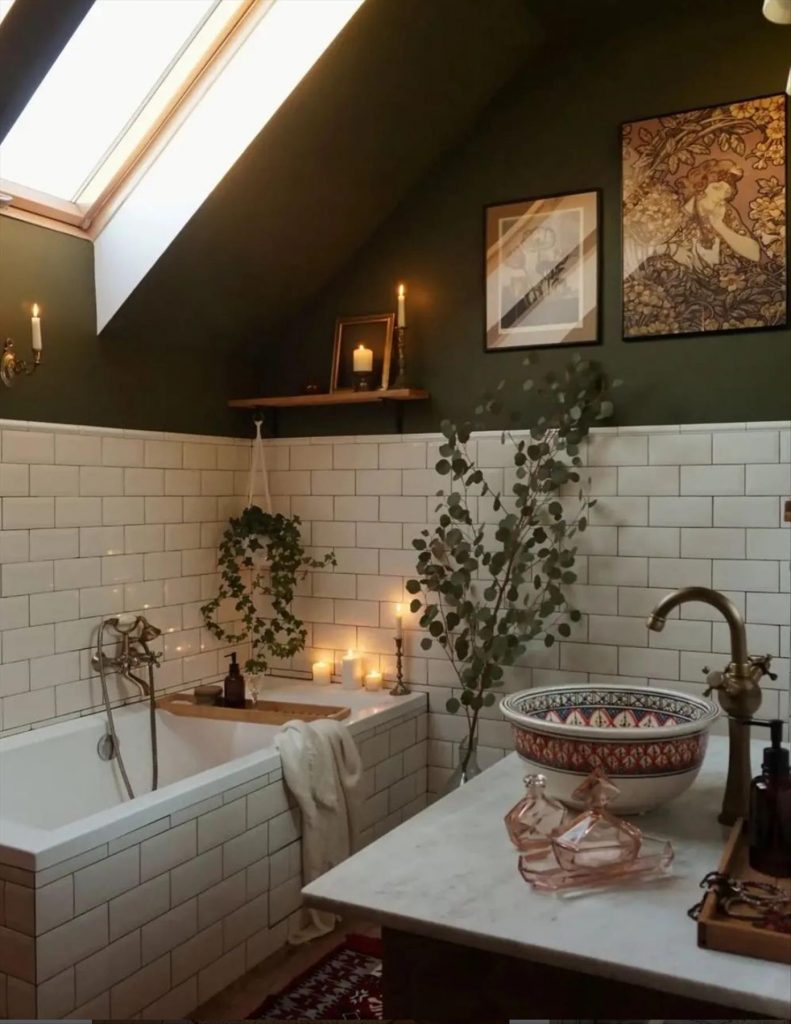 Let's talk about how to decorate the perfect boho bathroom. I noticed some common themes in the bathroom below. They feature houseplants, bamboo wood trim, and teal cabinets or tiles. Keep this in mind when looking for trends in boho bathroom design. Use natural materials and try to keep your decor as unpretentious as possible.