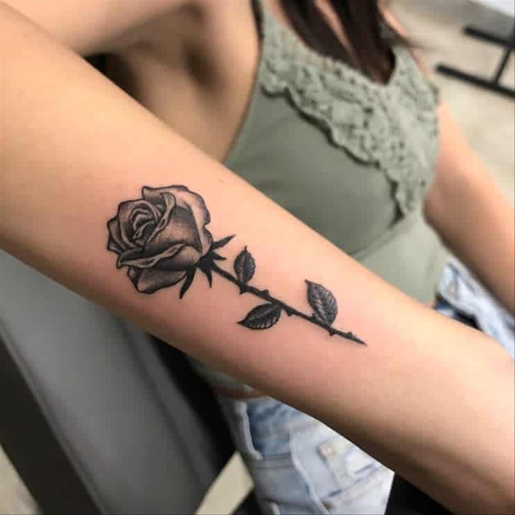 Elegant rose tattoo designs for women to ink now